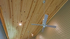 Rustic Barnwood Sandstone installed on range hood in kitchen. Reclaimed barn wood look